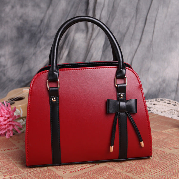 Elegant and Versatile Women's Handbag with Bow Accent