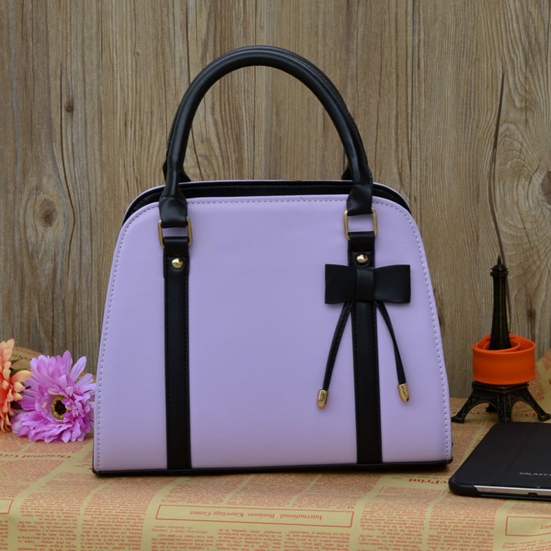 Elegant and Versatile Women's Handbag with Bow Accent