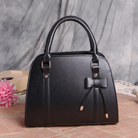 Elegant and Versatile Women's Handbag with Bow Accent