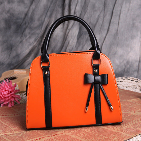 Elegant and Versatile Women's Handbag with Bow Accent