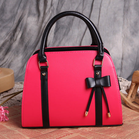 Elegant and Versatile Women's Handbag with Bow Accent