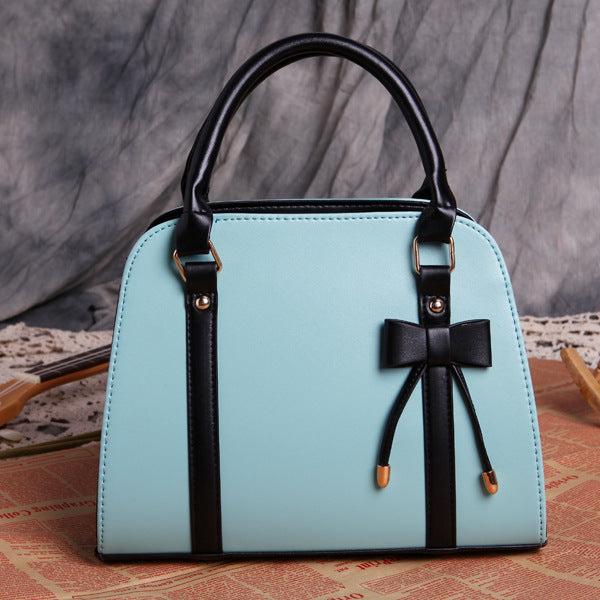 Elegant and Versatile Women's Handbag with Bow Accent