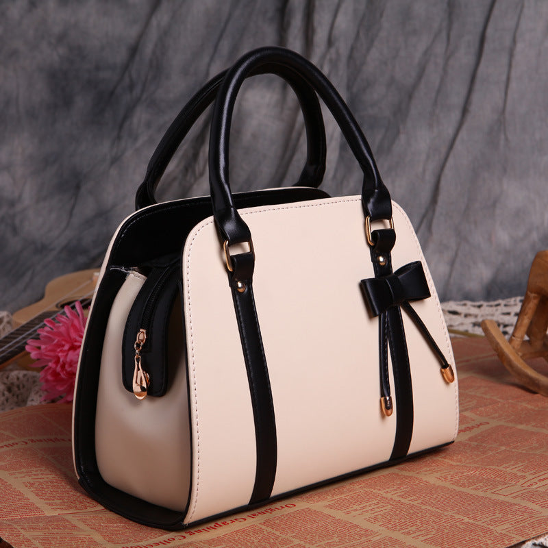 Elegant and Versatile Women's Handbag with Bow Accent