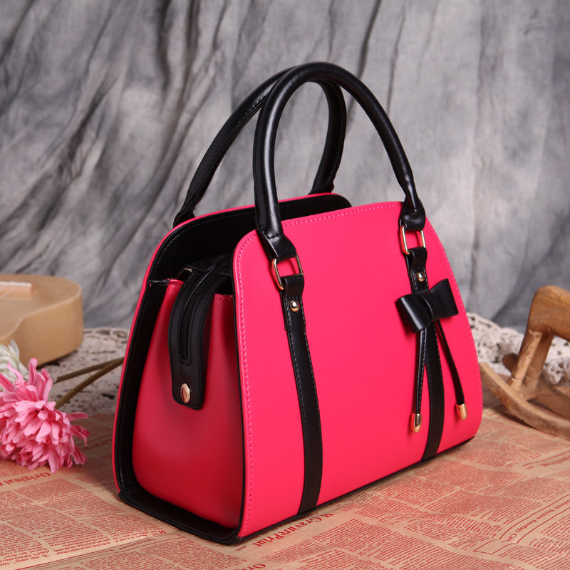 Elegant and Versatile Women's Handbag with Bow Accent