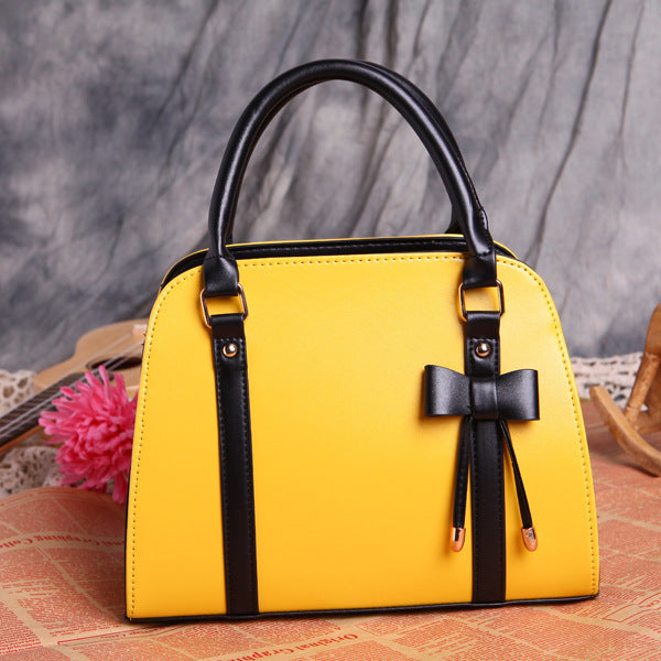 Elegant and Versatile Women's Handbag with Bow Accent