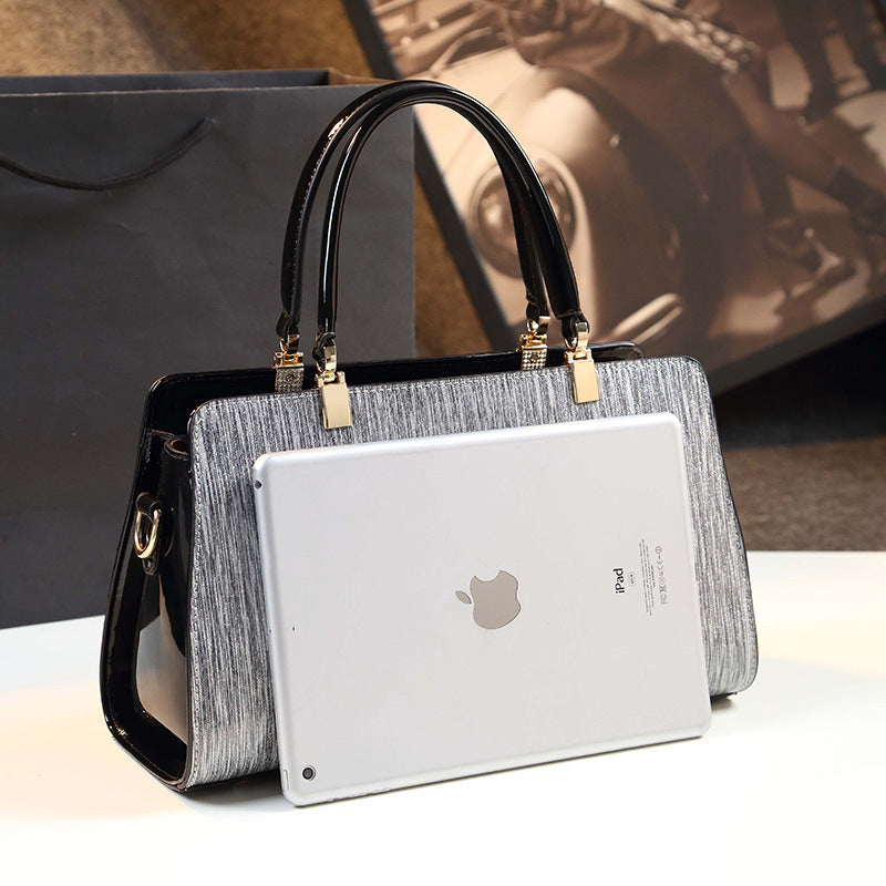 Sophisticated Bag - Stylish Striped Handbag with Metallic Accents