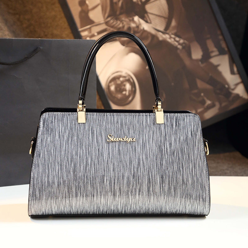 Sophisticated Bag - Stylish Striped Handbag with Metallic Accents