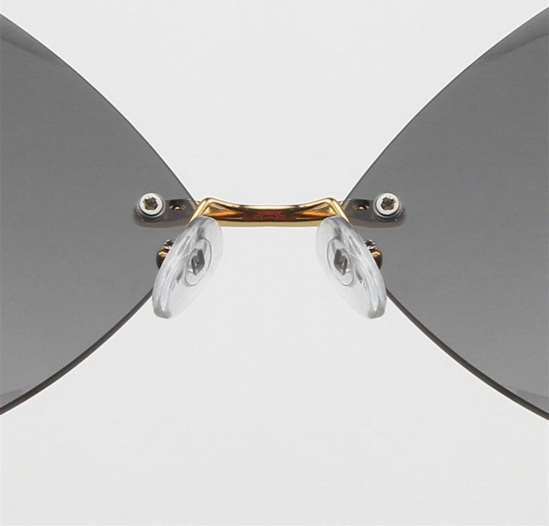 Stylish Rimless Round Sunglasses with Metal Accents